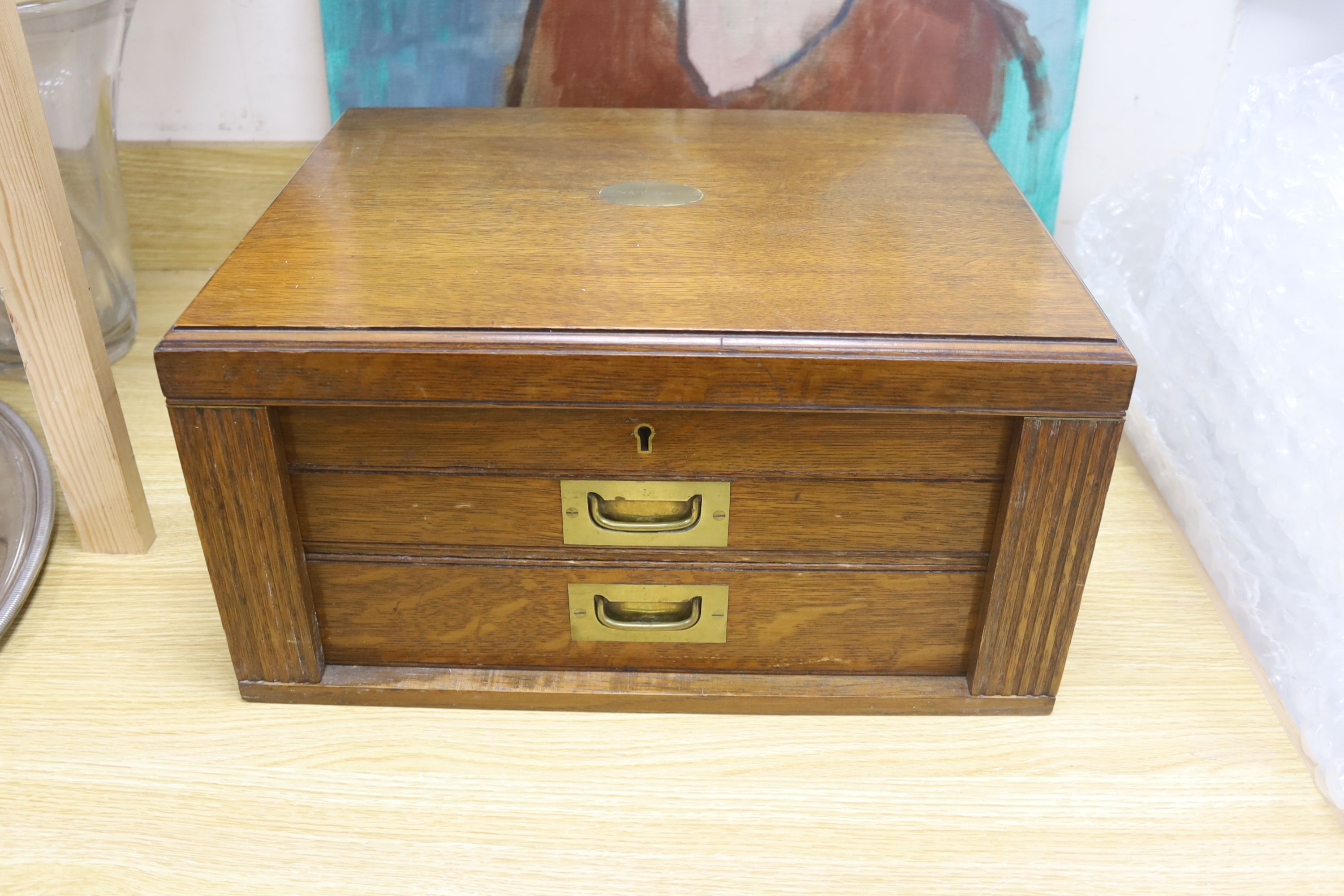 A large early 20th century oak cutlery canteen containing a large quantity of stainless steel cutlery, width 45cm depth 35cm height 23c